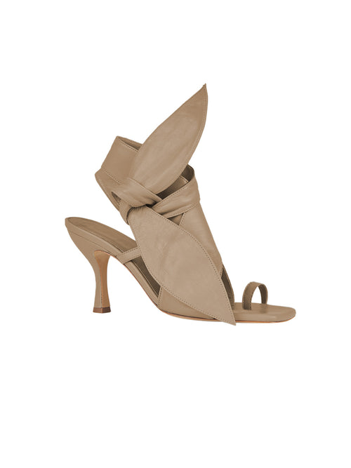 Marco Heel Camel toe-loop sandals with a large, decorative bow on the front, isolated on a white background.