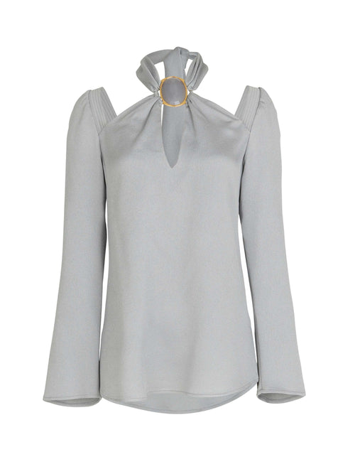 A Tavera Blouse Gray with a gold collar.