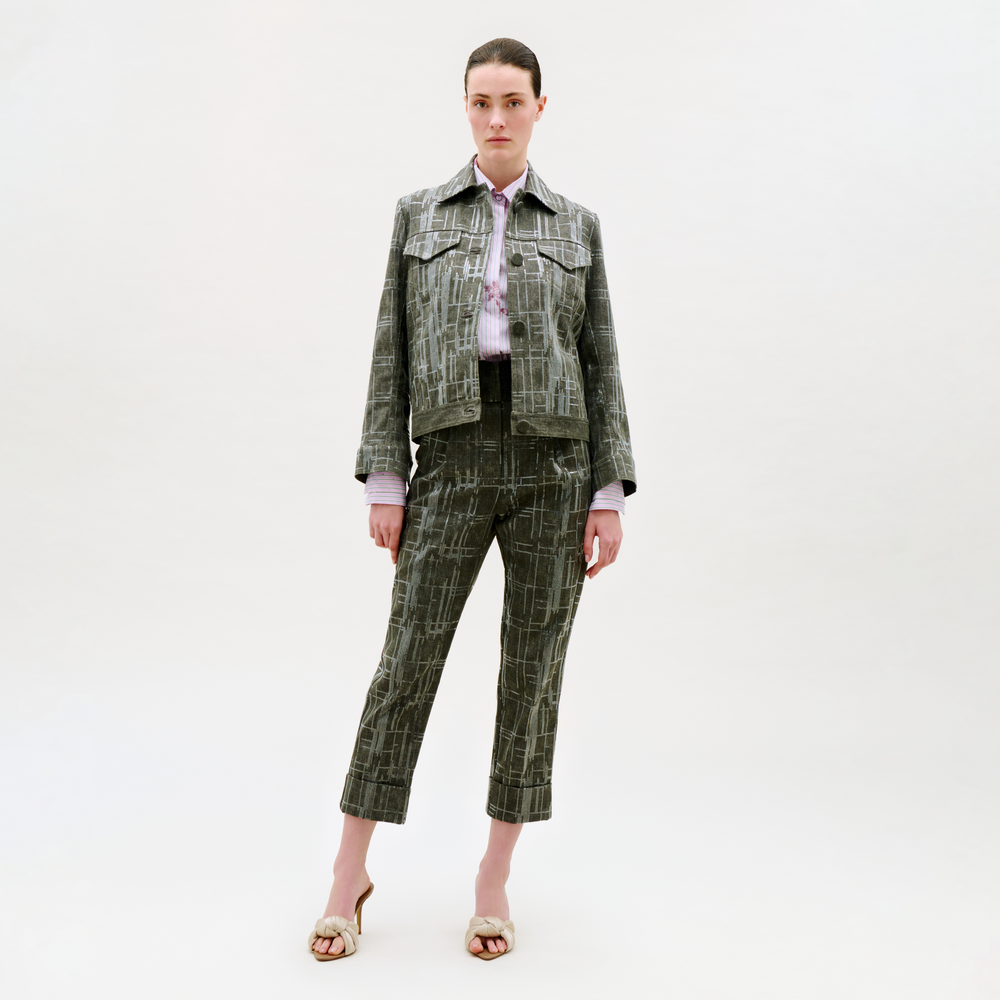 Woman wearing a plaid suit on a white background