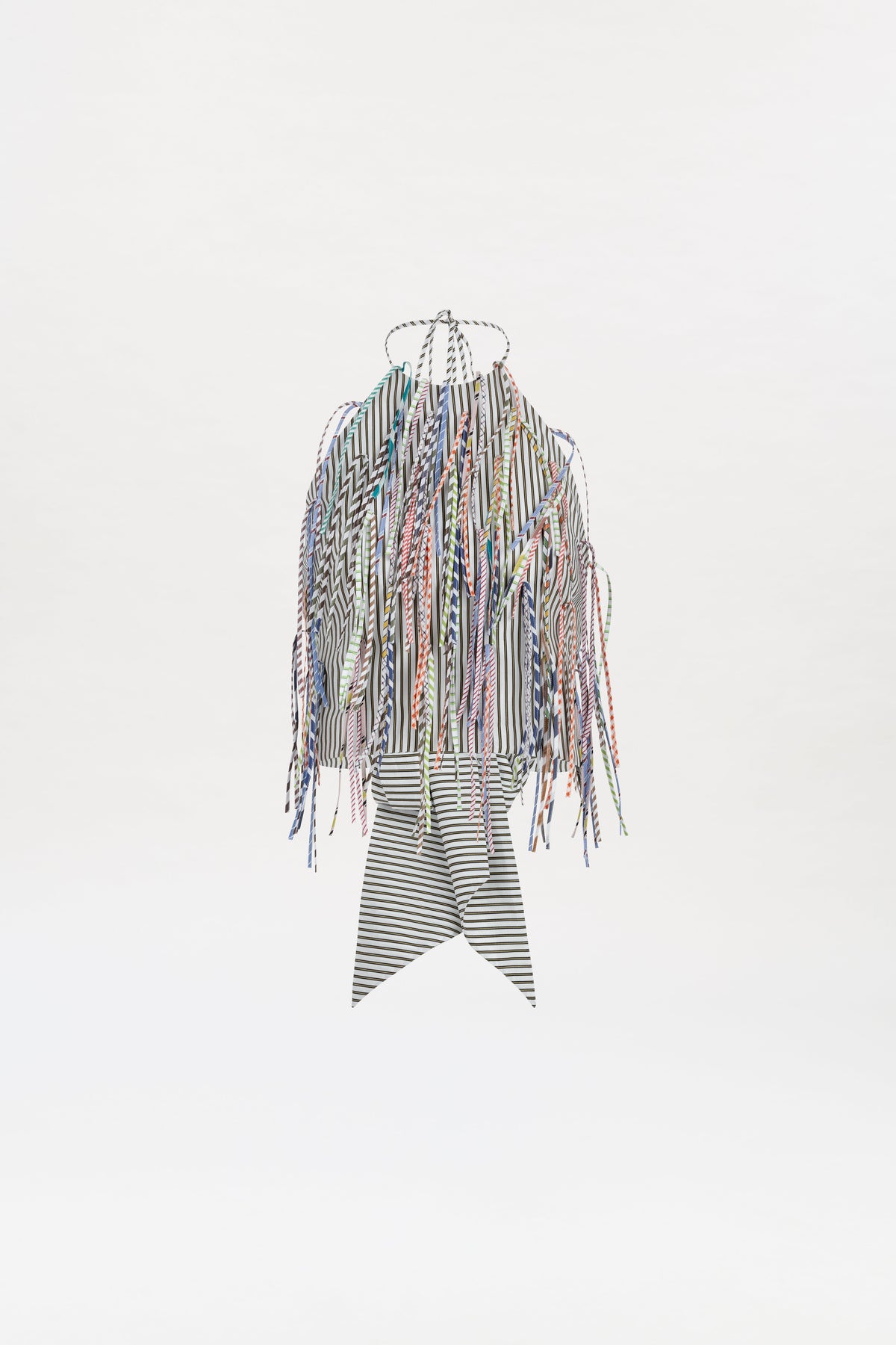 The Lianne Top features zigzag and chevron stripes, colorful fringe detailing along the sleeves and sides, and a pointed striped lower section, shown on a white background.