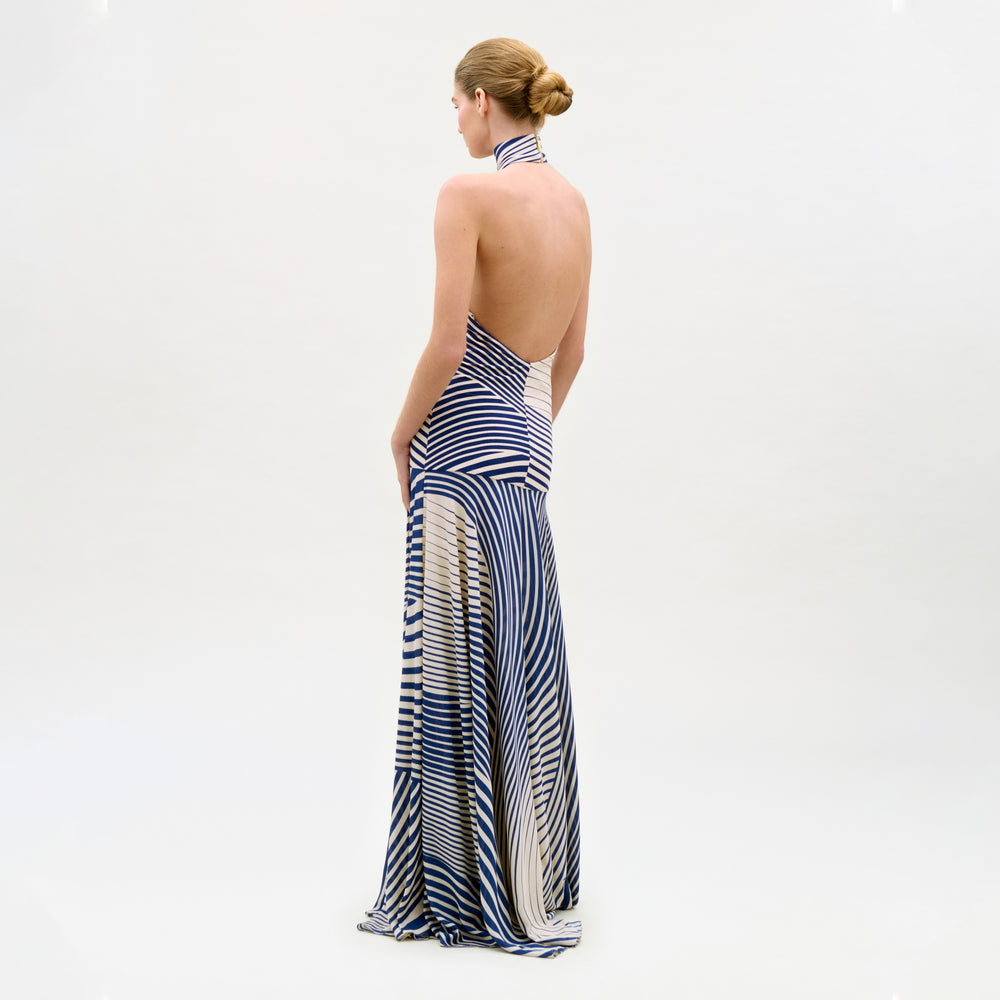 Woman wearing a blue and white striped dress on a white background
