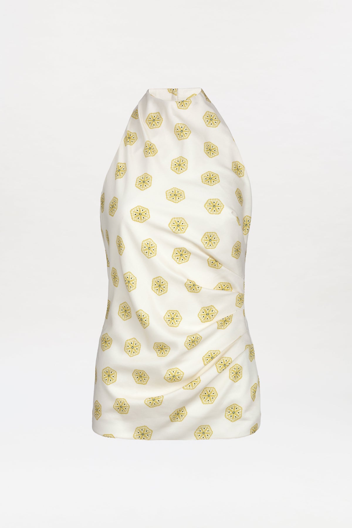 The Marine Blouse is a sleeveless white halter top with a subtle sheen, featuring an evenly spaced pattern of small yellow geometric shapes across the fabric. Shown on a plain white background.
