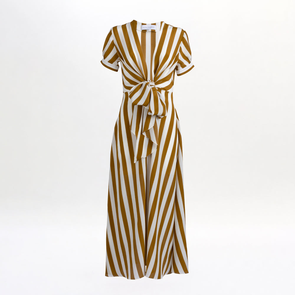 The Zila Dress is a short-sleeved, wide-leg jumpsuit made from luxurious 100% Italian silk with bold diagonal brown and white stripes and a tie-front waist, shown against a plain white background.