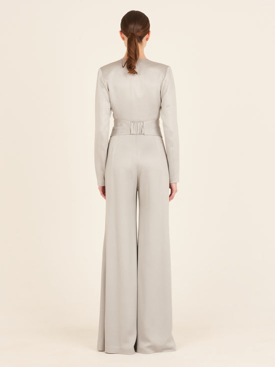 A Taboa Jumpsuit Gray with a waist-defining belt.