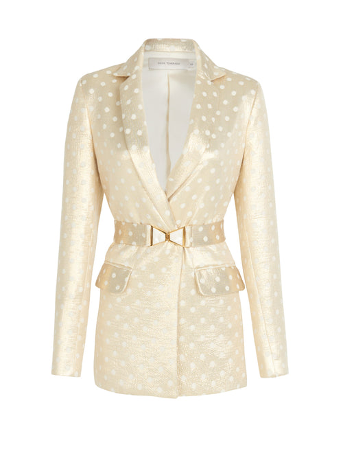 A Sube blazer with polka dots and a gold belt available for Fall 2023.