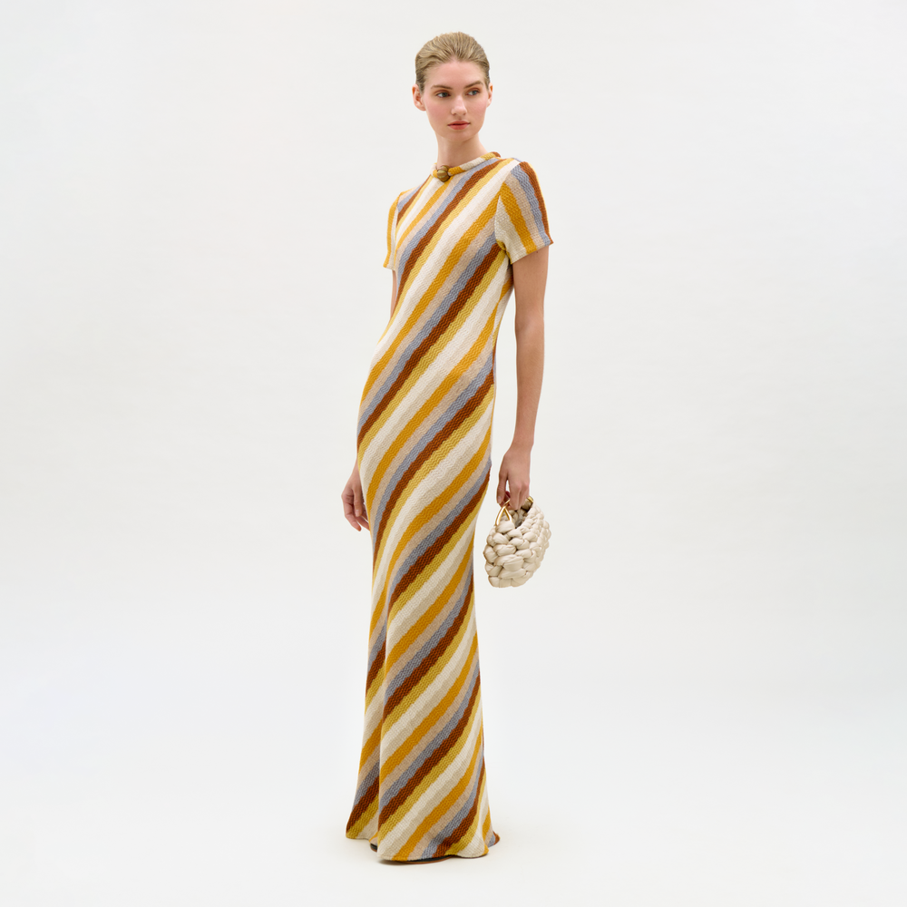 Woman wearing a striped dress on a white background