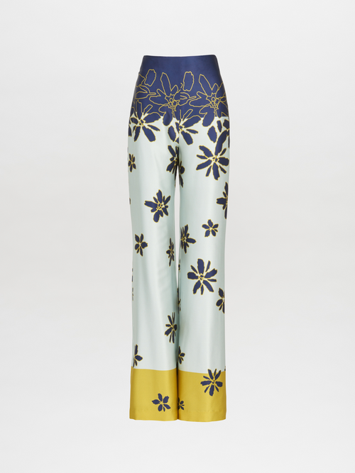 Como Pant Navy Citrine, featuring a wide-leg design with a floral print in blue and yellow flowers set against a light background.