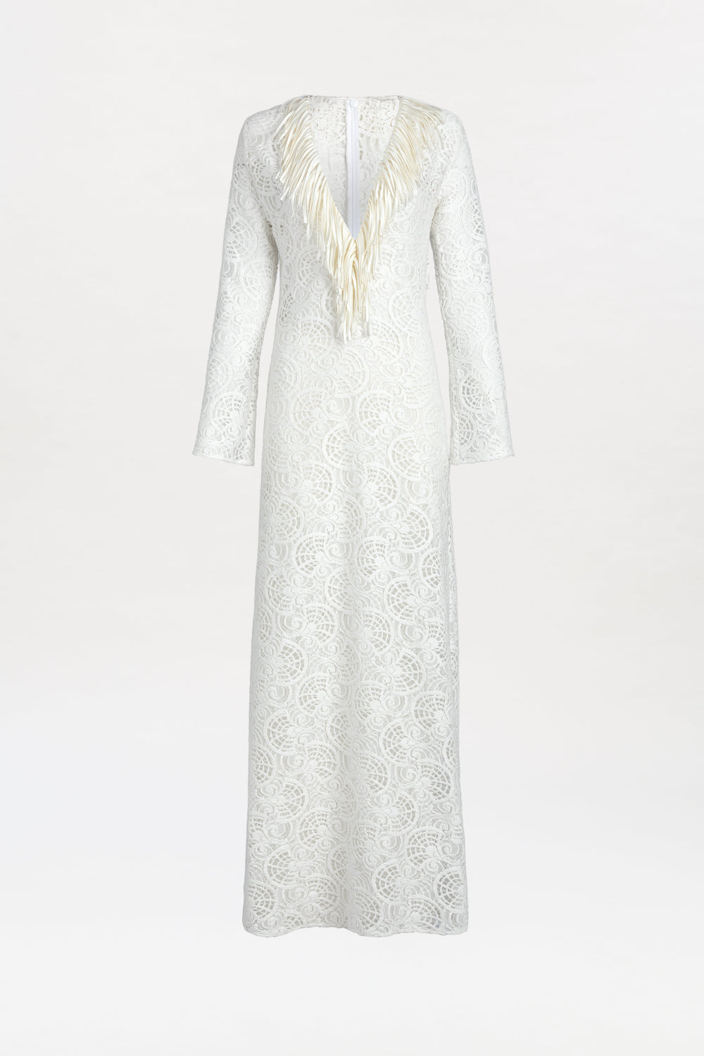 The Vilma Dress is a long-sleeved, floor-length white lace gown featuring a deep V-neckline embellished with cream-colored feather details, showcased against a plain white background.