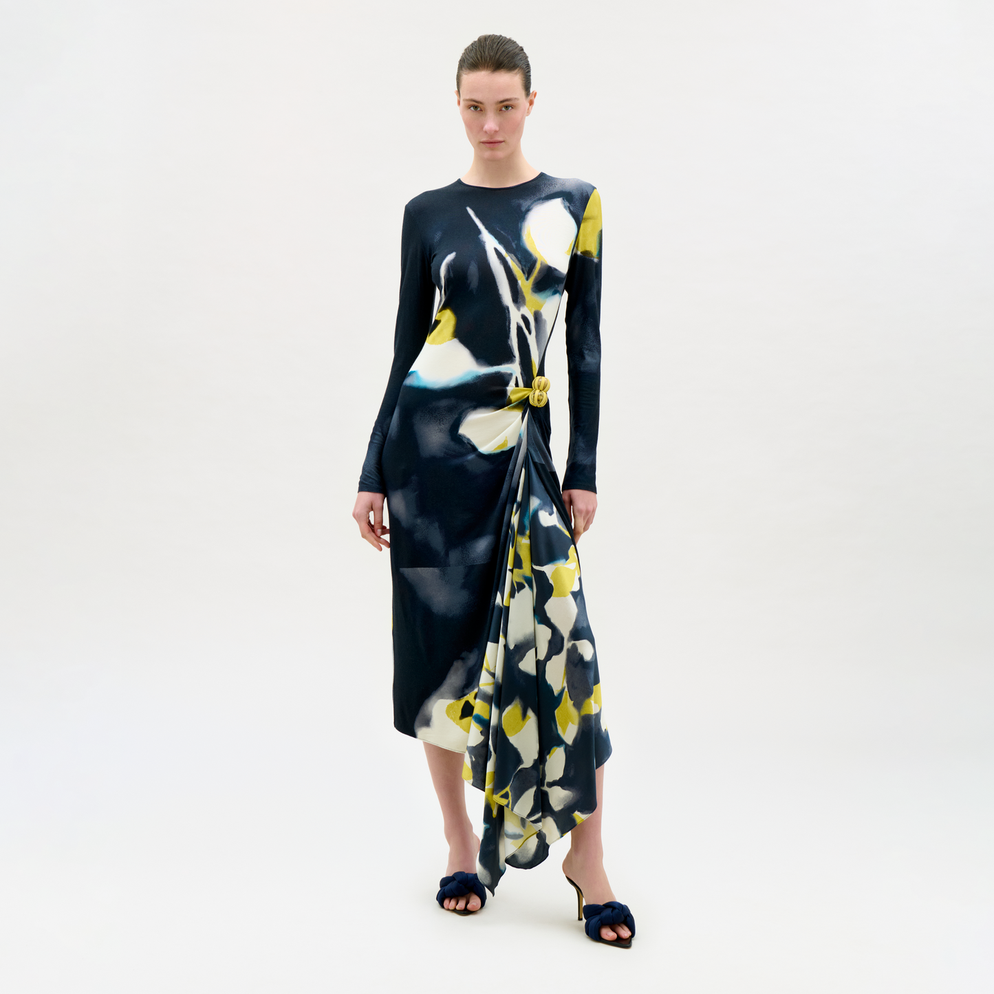Woman wearing a floral dress on a white background