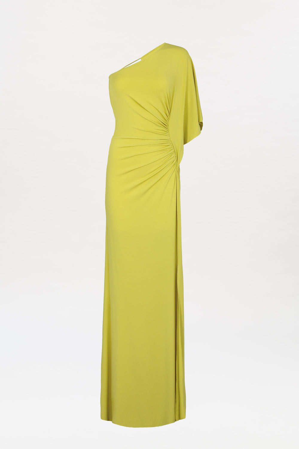 The Doli Dress is a long, yellow-green one-shoulder gown featuring ruched detailing at the waist, draped fabric, and a floor-length hem, shown against a plain white background.