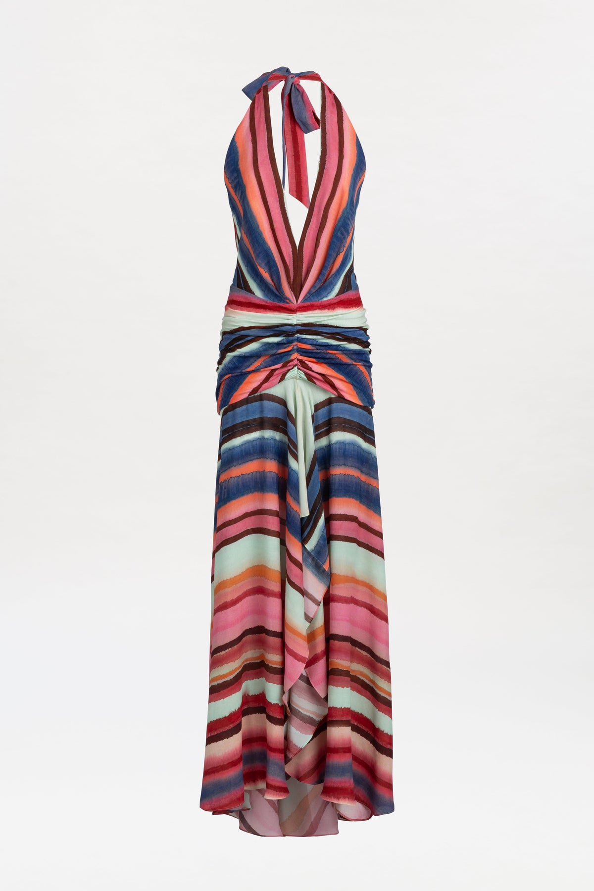 Introducing the Patsy Dress—a sleeveless, halter-neck maxi featuring a plunging neckline and ruched waist. Designed with multicolored horizontal stripes in pink, blue, red, and green hues, it flows to ankle length with a subtle front slit for added movement.