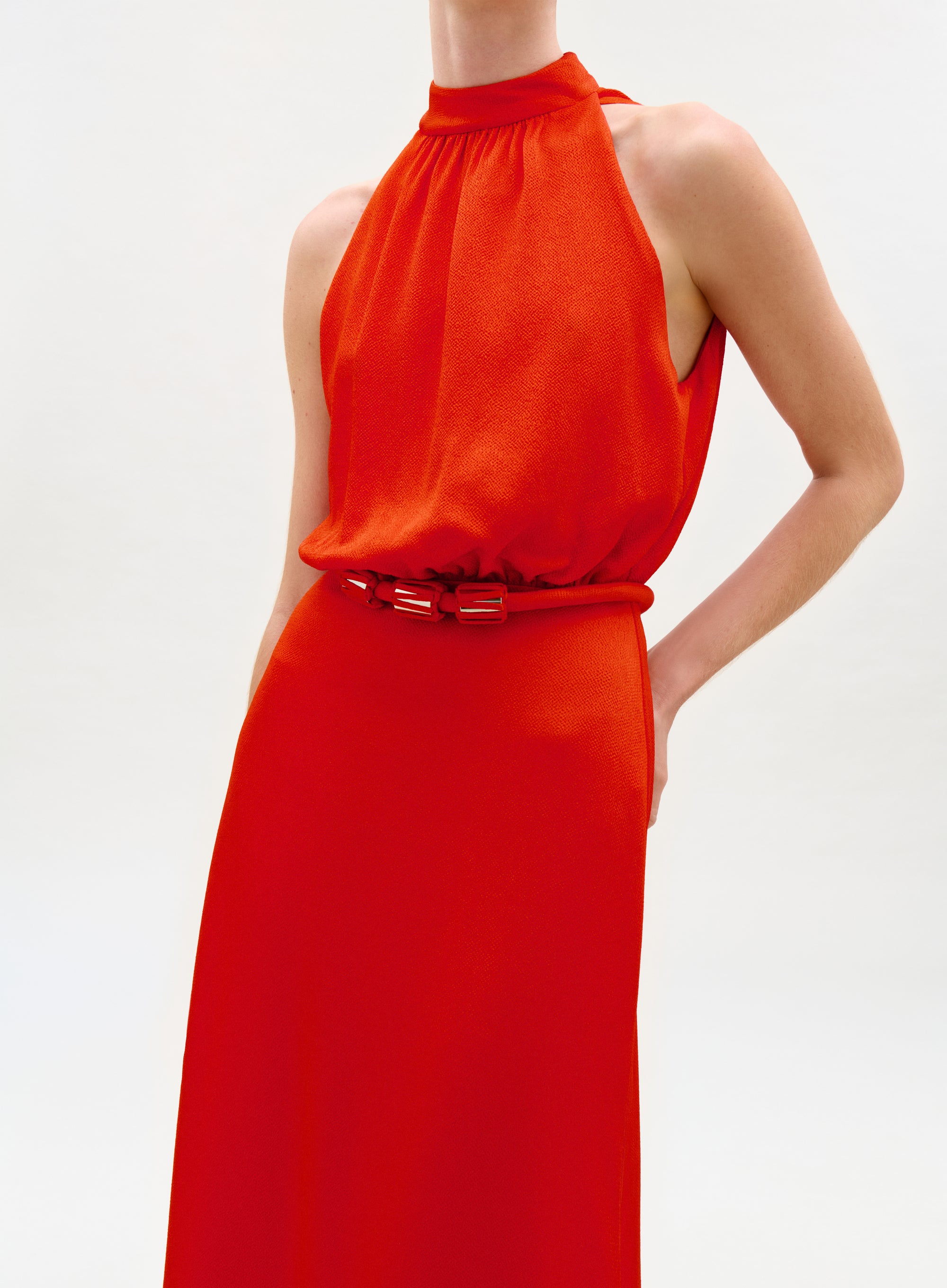 Red sleeveless dress on a white background