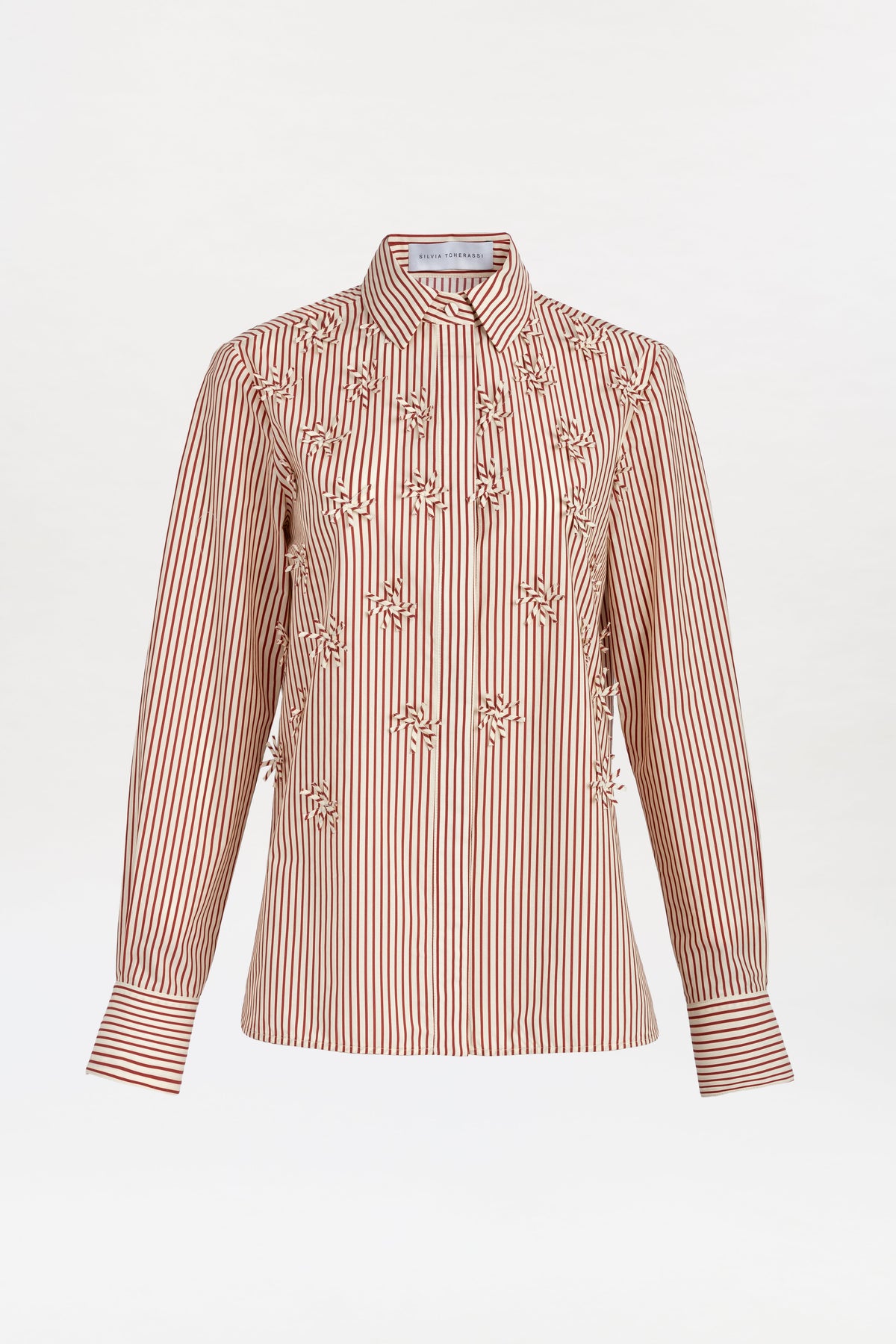 Naroa Shirt—a long-sleeve, button-up shirt featuring red and white vertical stripes and ruffle details on the front, displayed against a plain white background.