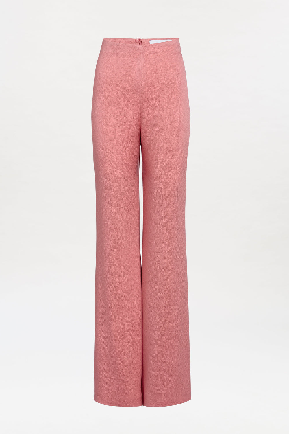 The Palermo Pant is a high-waisted, wide-leg pink trouser showcased against a plain white background. It features a smooth texture and a fitted waist with a back zipper closure.