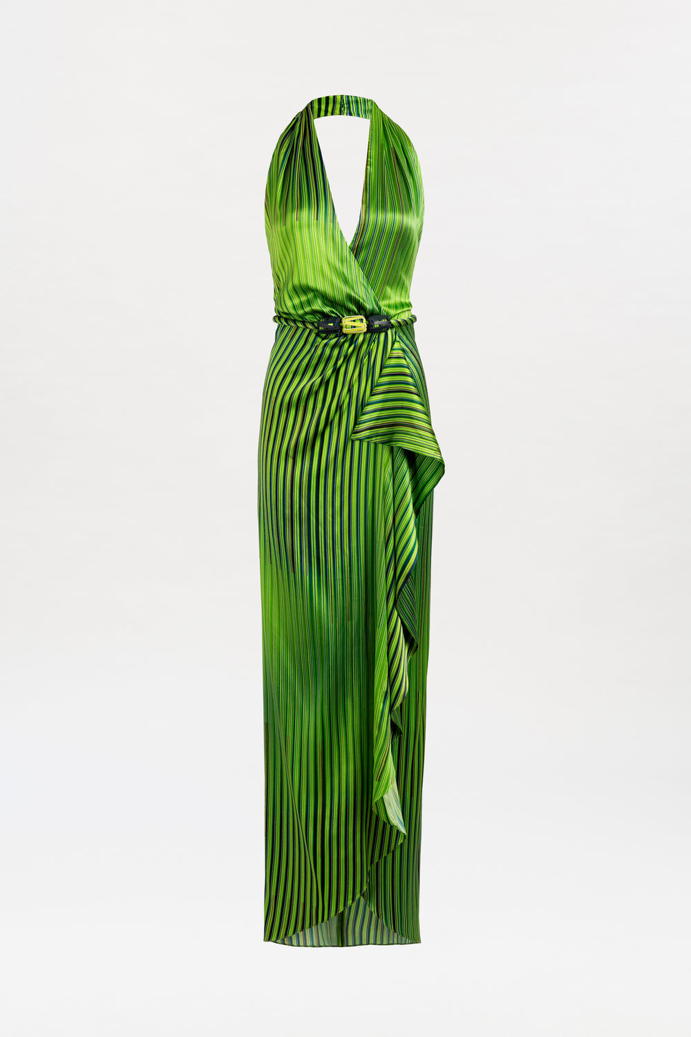 The Gypsy Dress is a sleeveless green maxi with black vertical stripes, a deep V halter neckline, belted waist, and draped asymmetrical skirt made from fine Italian textile, shown against a plain white background.