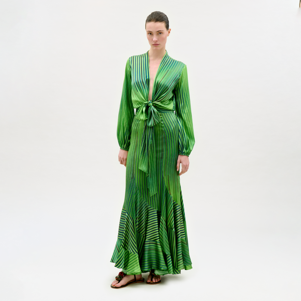 Woman wearing a green dress with a white background