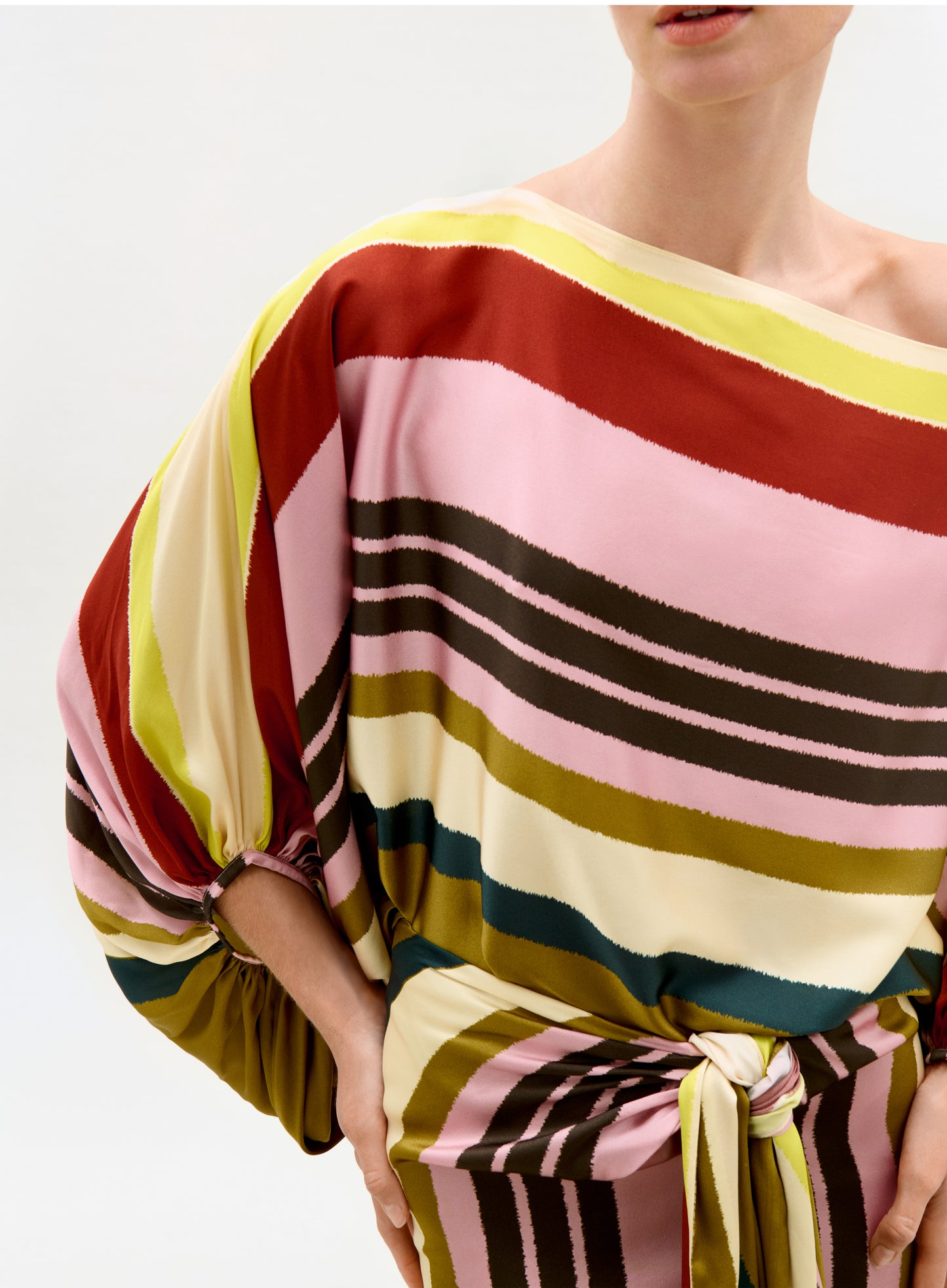 Multicolored striped dress with a plain background
