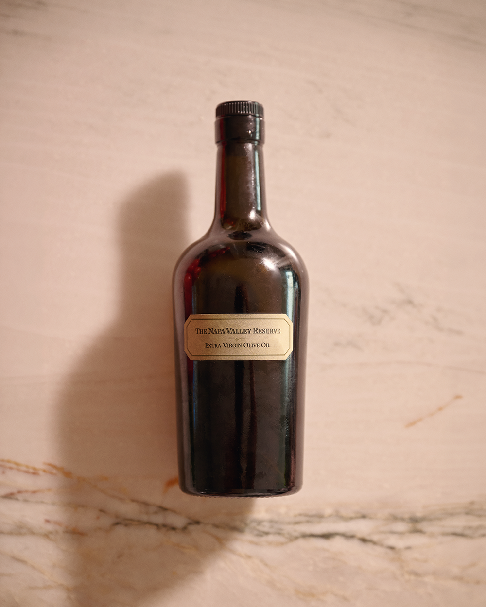 Bottle of wine labeled 'Napa Valley Reserve' on a marble surface
