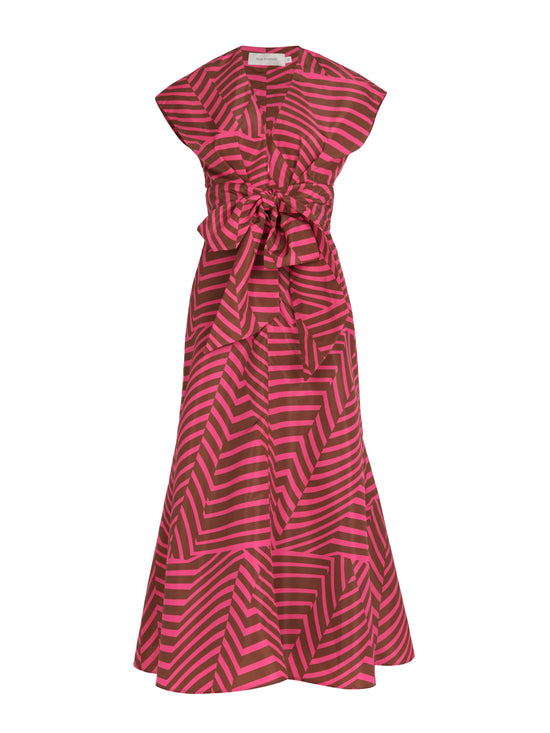 A feminine Toledo Dress Fuchsia Cacao with a bow, perfect for any occasion.