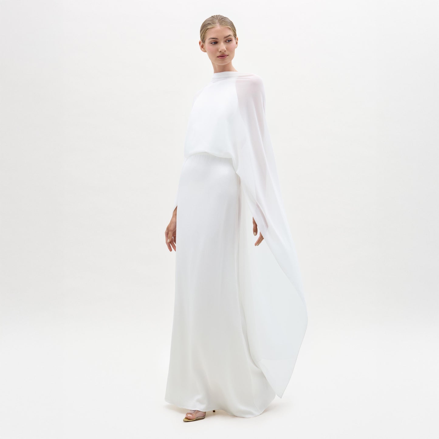 Woman wearing a white outfit on a white background