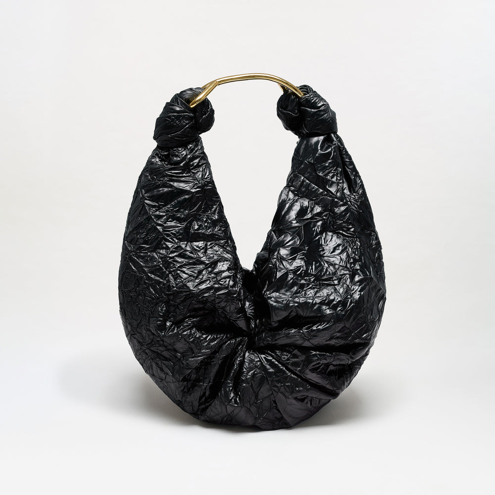 The Sofia Bag (Maxi) is a black, crinkled hobo-style maxi bag featuring a gold-toned handle and crafted from luxurious Italian fabric, displayed against a plain white background.