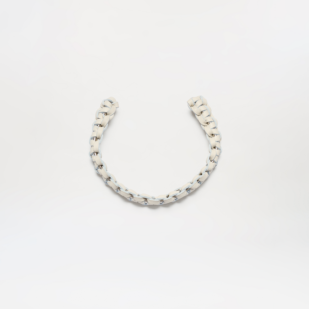 The Talal Chocker is a short, thick, white braided rope displayed in a loose U-shape against a plain white background.