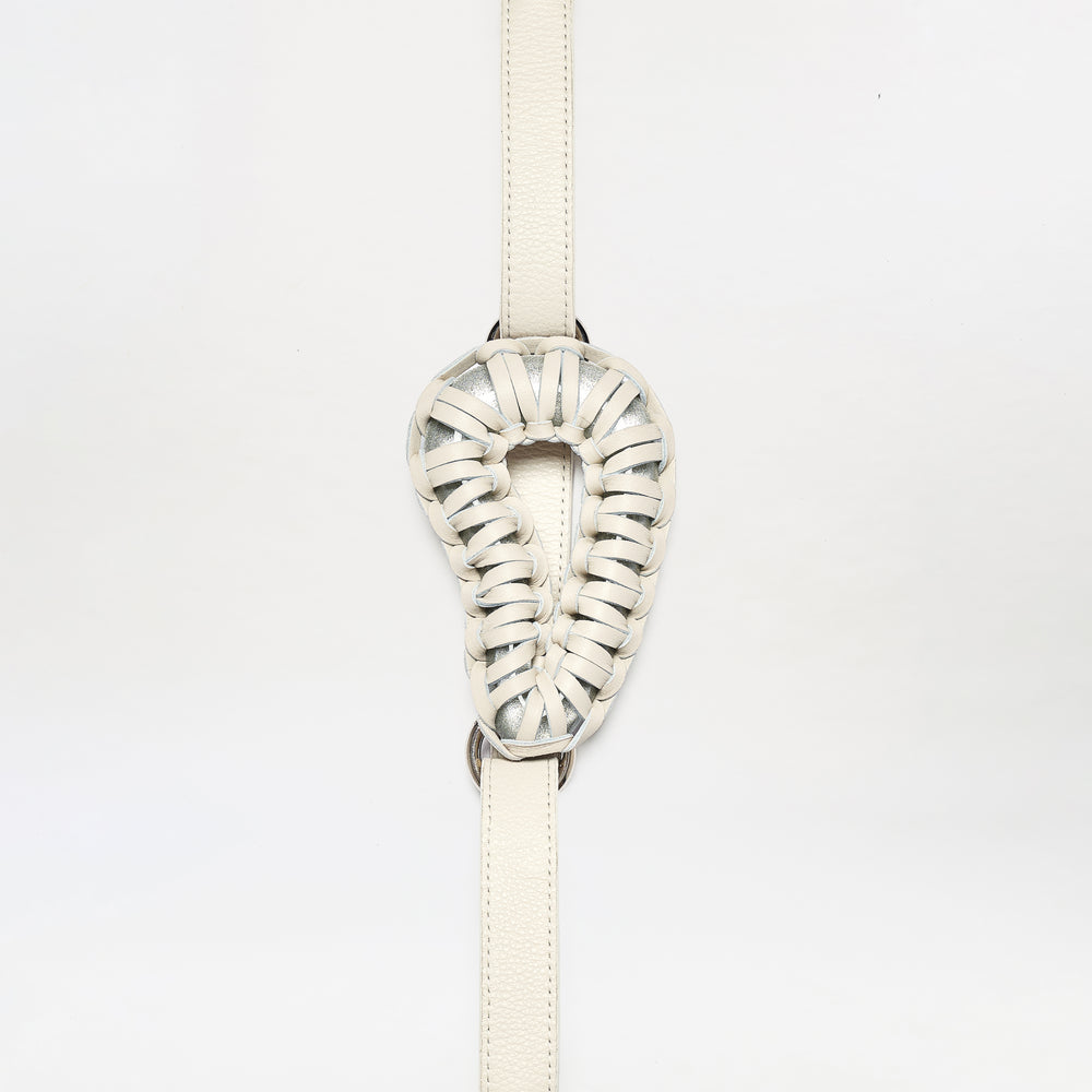 The Renata Belt is a cream-colored, intricately woven leather accessory featuring a looped oval center, shown against a plain white background.