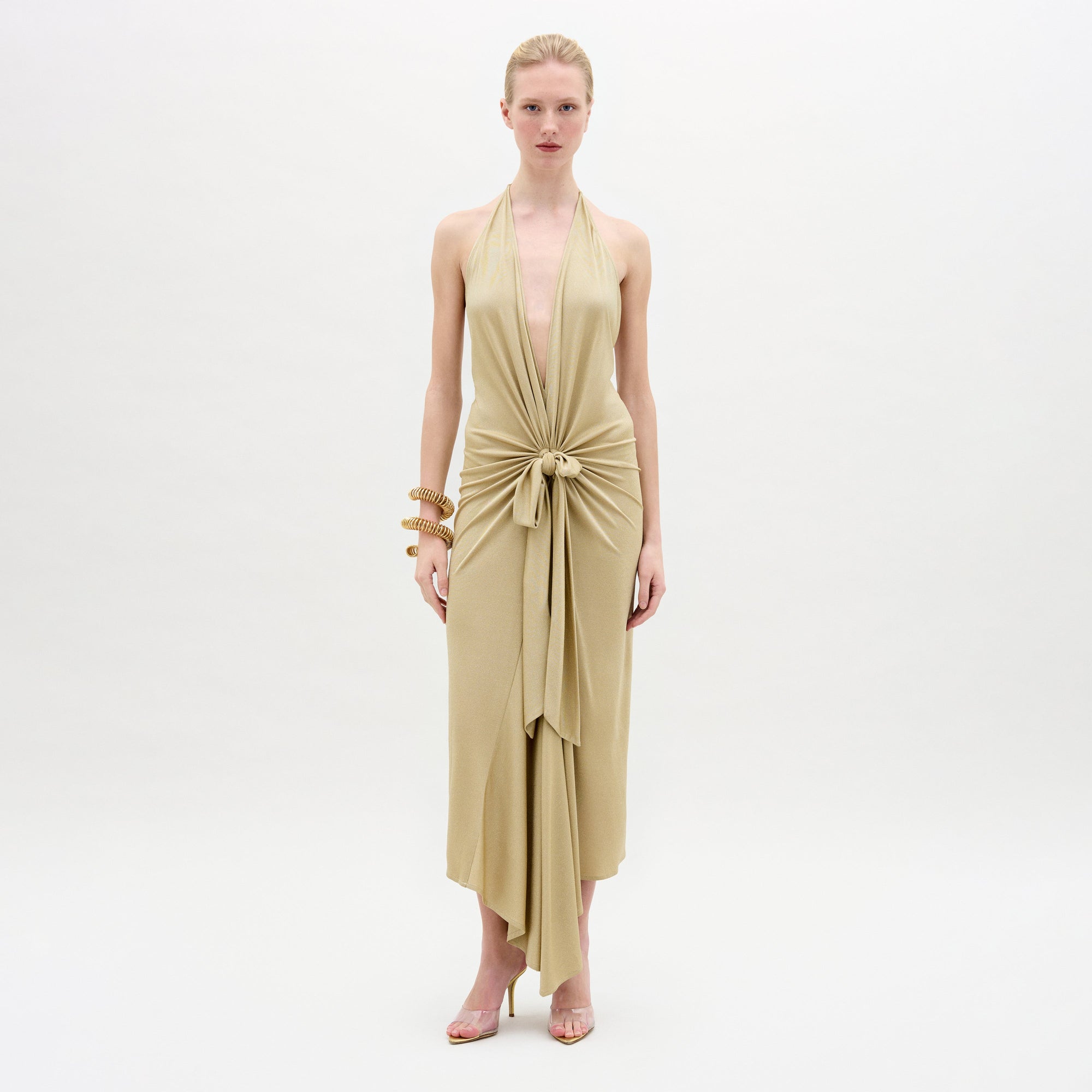 A woman wearing the Adara Dress on a white background