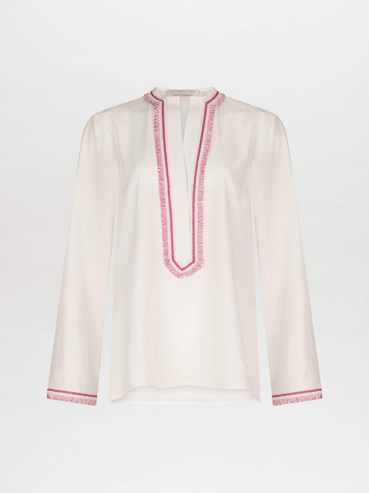 An Anisa Blouse White with pink trim and V neckline.