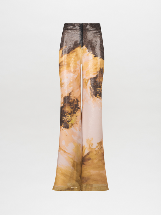 A pair of Avellino Pant Golden Peony with an abstract print.