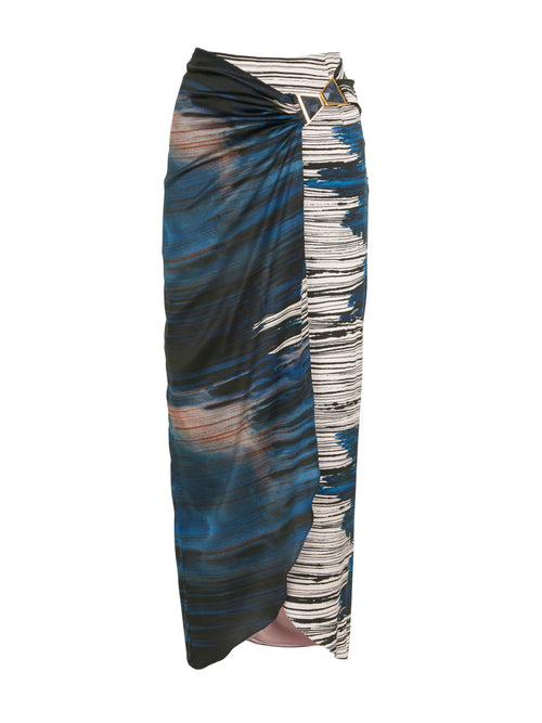 A lightweight Adrianne Skirt Indigo Linear midi skirt with a belt.