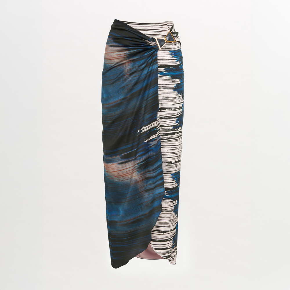 A lightweight Adrianne Skirt Indigo Linear midi skirt with a belt.