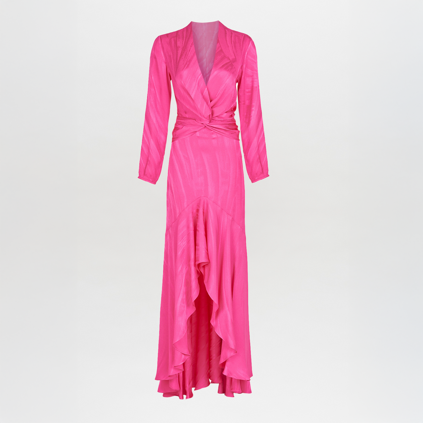 The Albarella Dress Fuchsia is a long-sleeved, floor-length jacquard dress featuring a wrap-style bodice, waist-defining bow tie, and ruffled high-low hemline, shown against a plain white background.