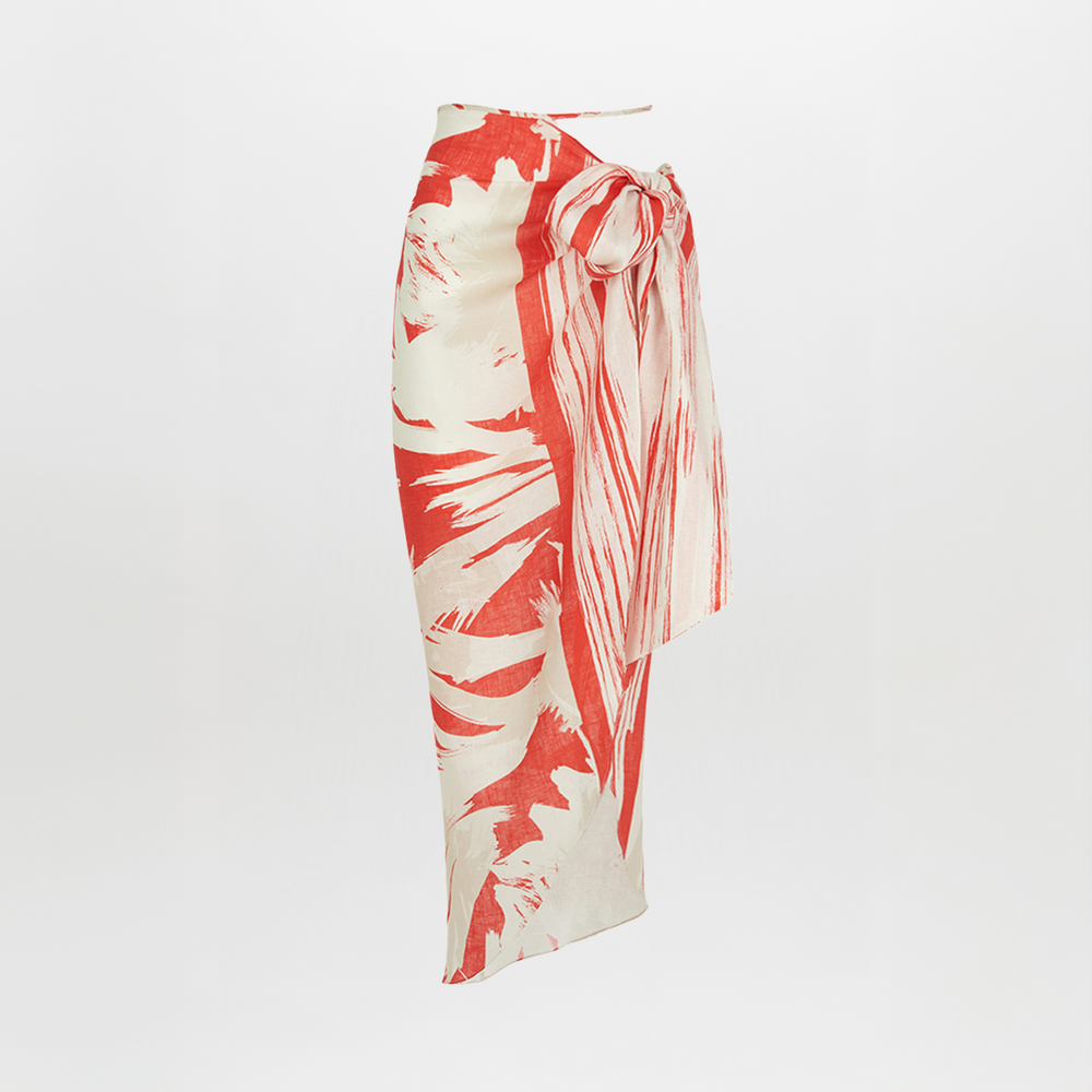 A Alice Skirt Coral Red Palm Print with a bow on it.