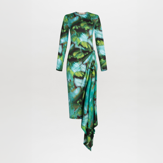 Ananya Dress Juniper Green with a green and blue abstract leaf pattern and asymmetrically draped skirt, isolated on a white background.