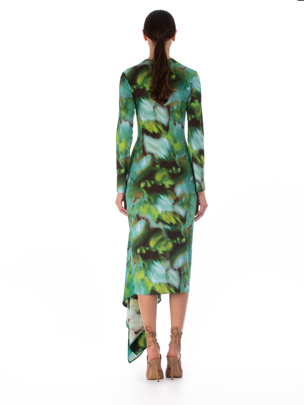 Ananya Dress Juniper Green with a green and blue abstract leaf pattern and asymmetrically draped skirt, isolated on a white background.