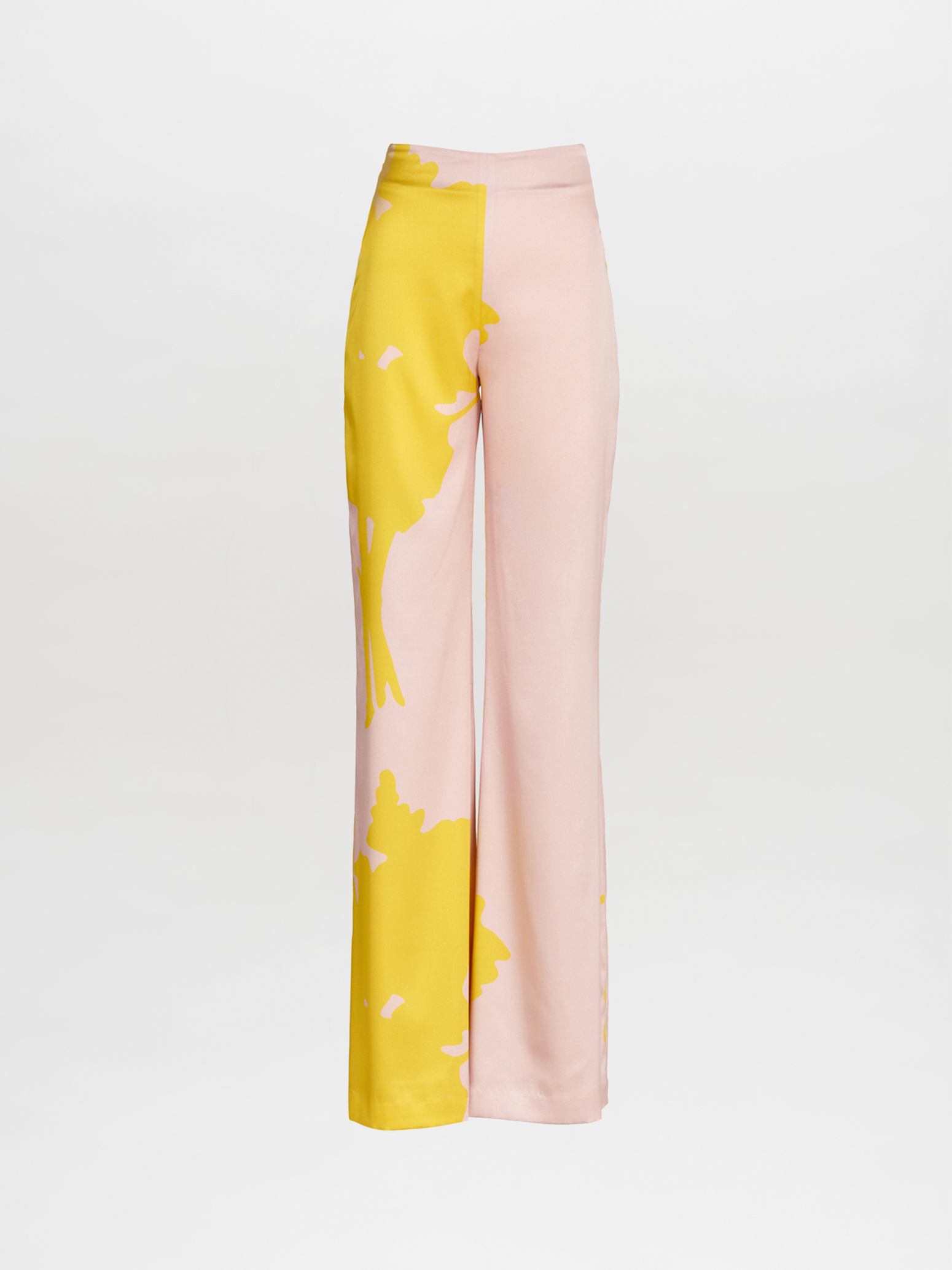 A pair of pink and yellow Andie Pant Yellow Nude Floral, wide-legged and high-waisted.