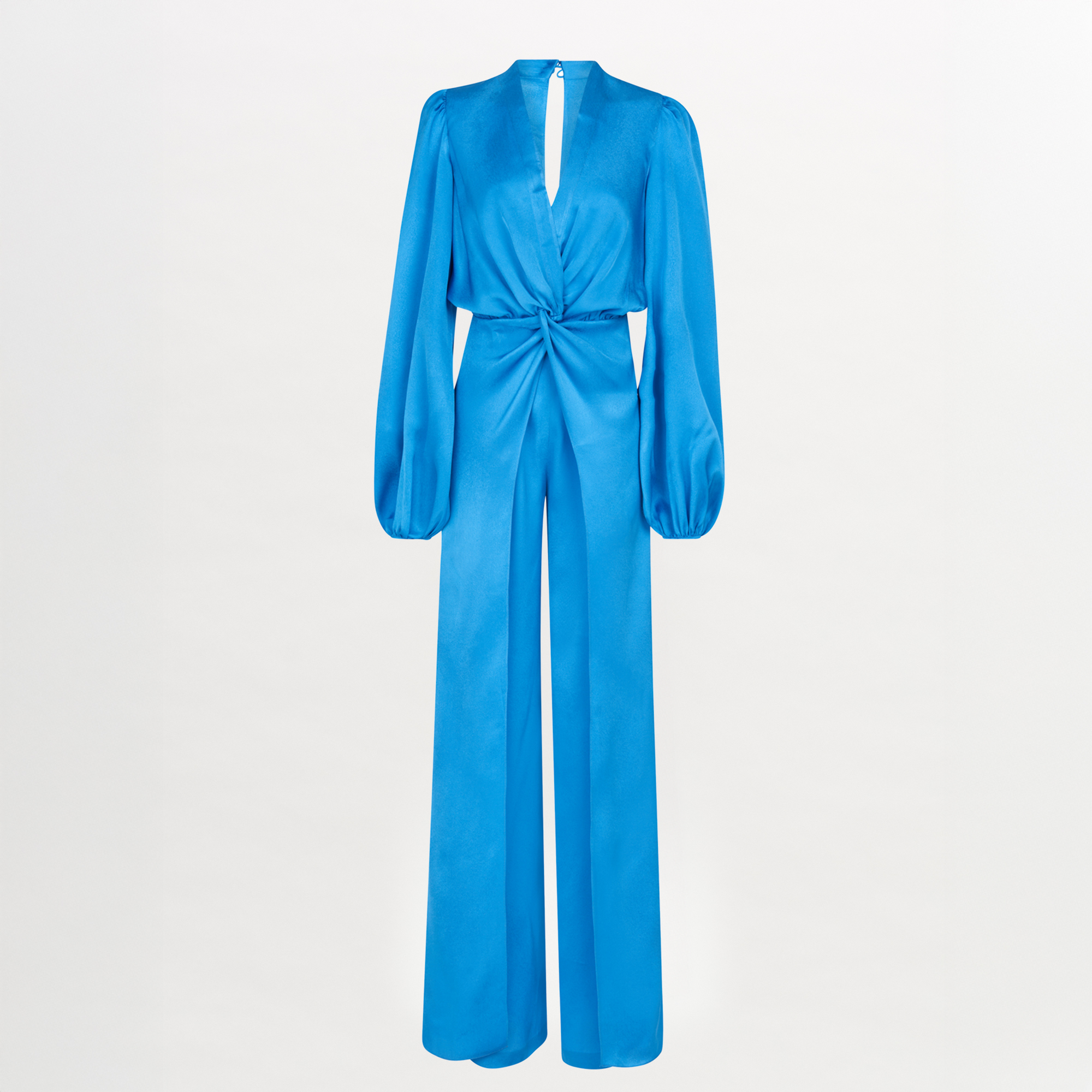 Woman standing with her back facing the camera, wearing the Arnetia Jumpsuit Blue with wide-leg pants.