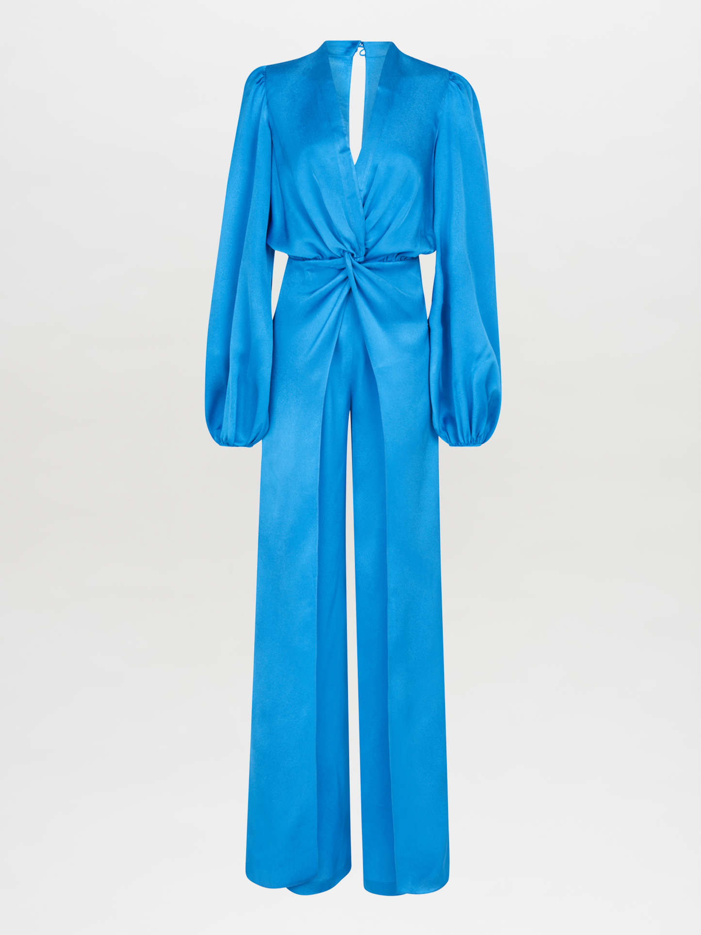 Woman standing with her back facing the camera, wearing the Arnetia Jumpsuit Blue with wide-leg pants.