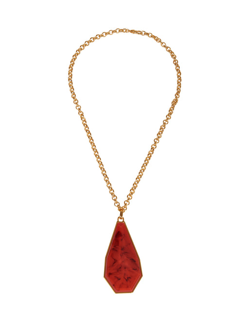 A Ascoli Necklace Rouge with a red stone pendant on a gold chain can be ordered online and shipped within days.