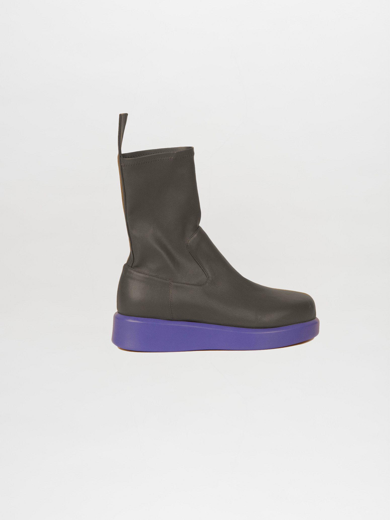 The Baia Boots Black Violet feature a sleek design with a vibrant purple sole, crafted from soft stretch calf leather, all set against a white background.