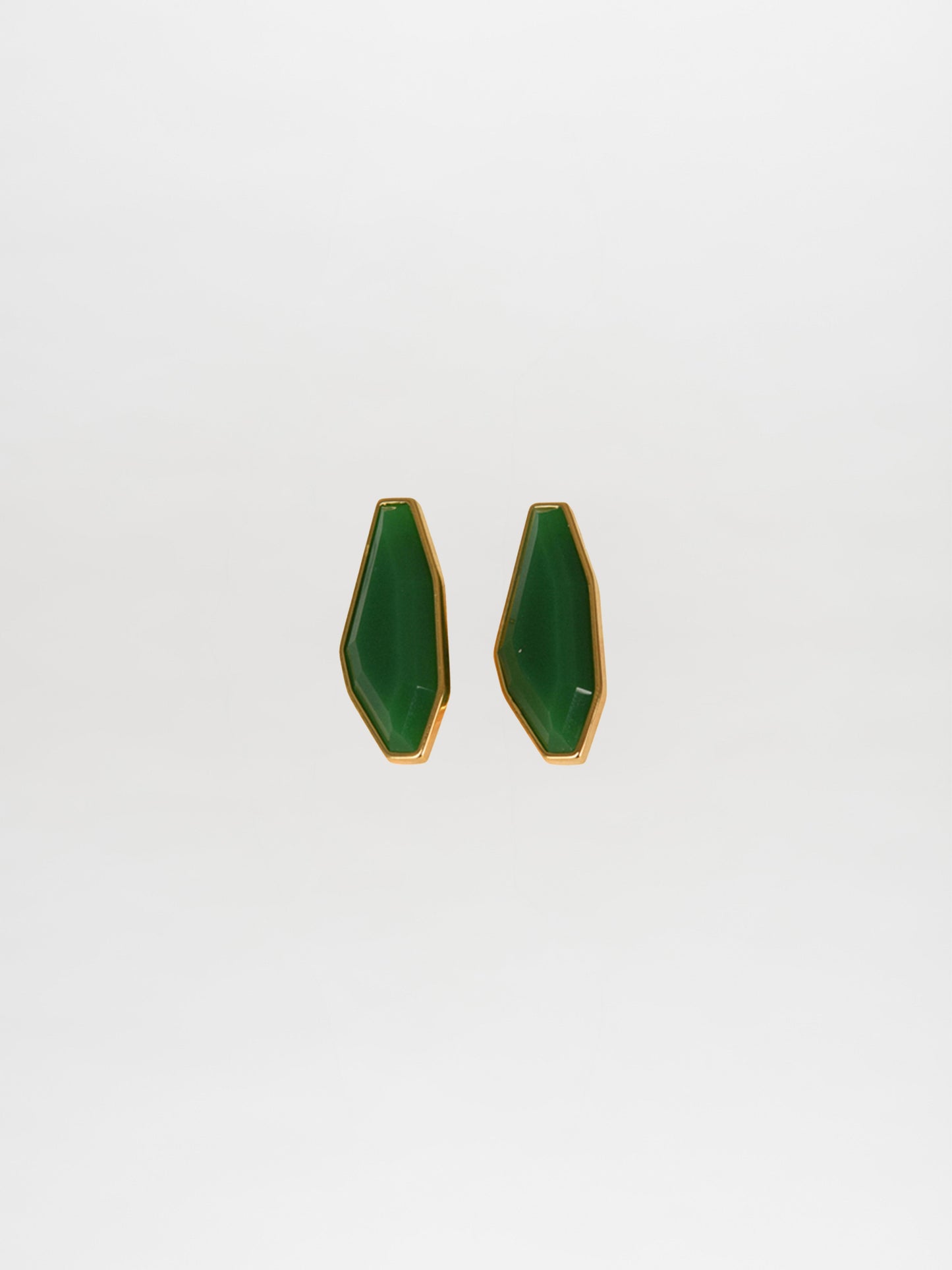 Badra Earrings Emerald: Elegant green geometric earrings with gold trim on a white background, highlighting the beauty of Italian resin.