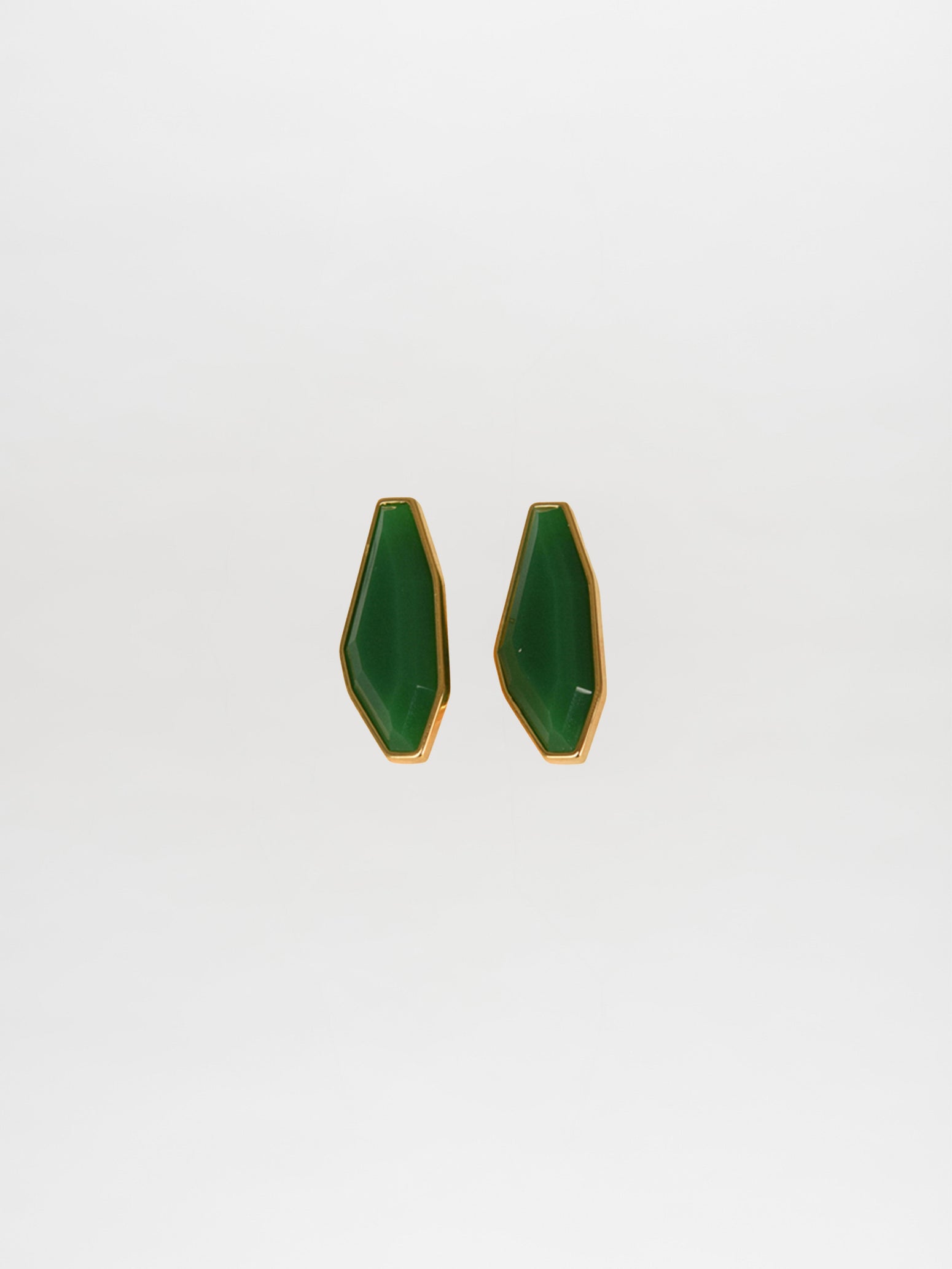 Badra Earrings Emerald: Elegant green geometric earrings with gold trim on a white background, highlighting the beauty of Italian resin.