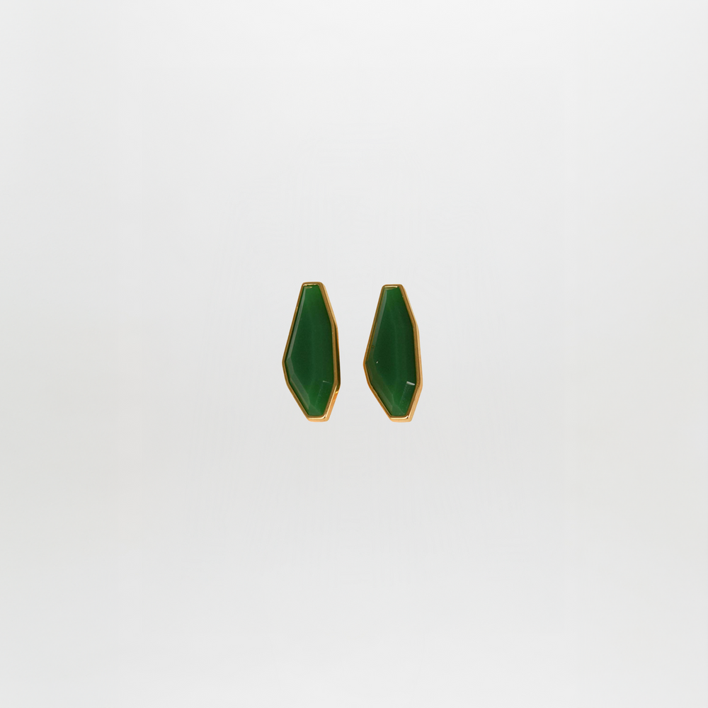 A pair of Badra Earrings Emerald, geometric green with gold trim, crafted from Italian resin, displayed against a plain white background.