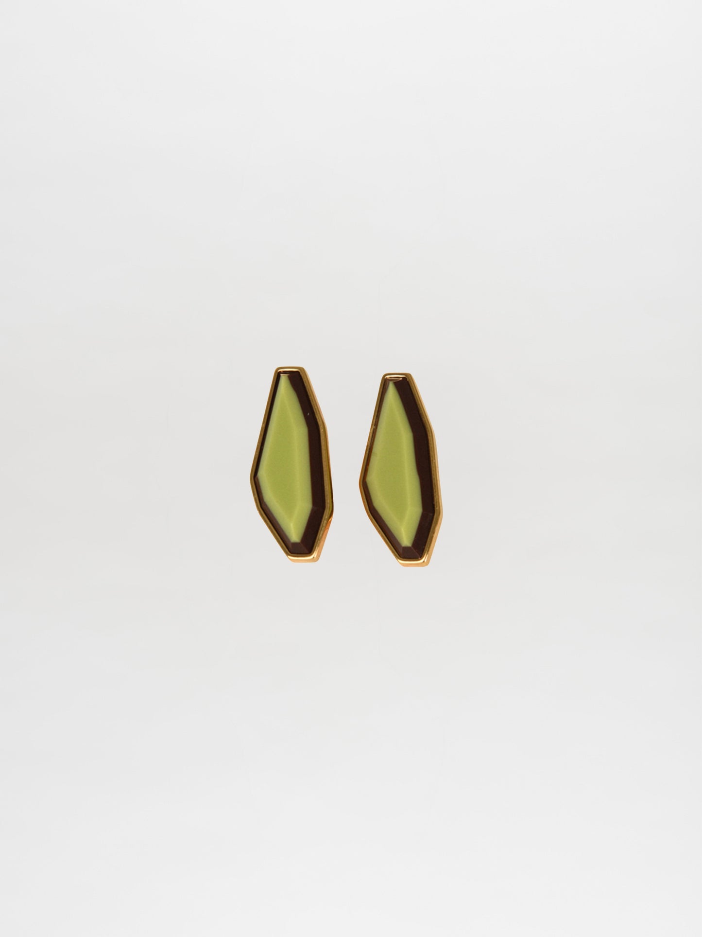 A pair of geometric Badra Earrings Lime with gold trim and faceted fantasy lime-green centers, shown on a plain white background.