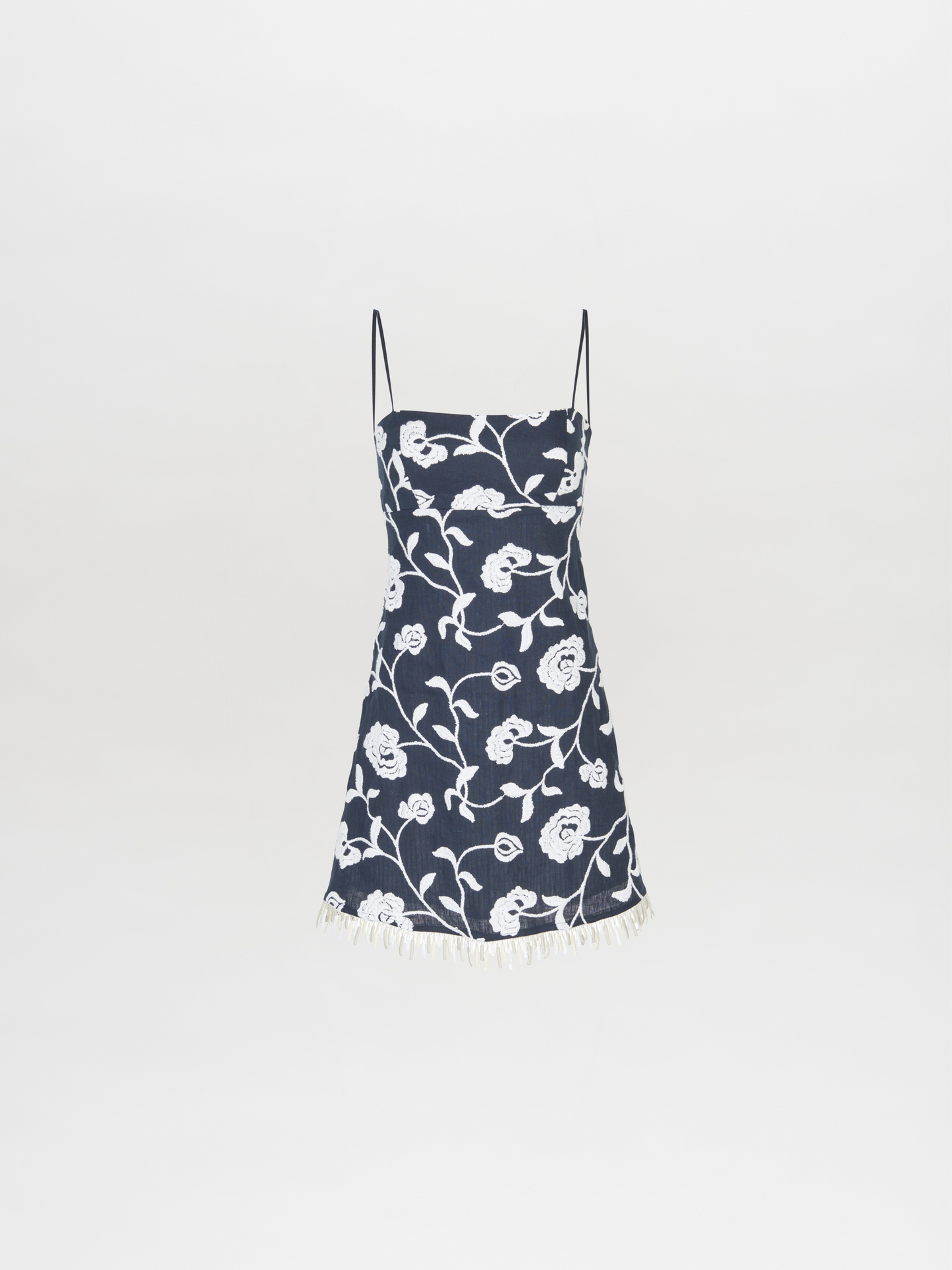 A Ballerina Dress Navy Embroidered with fringes is perfect for a summer wedding or garden party.