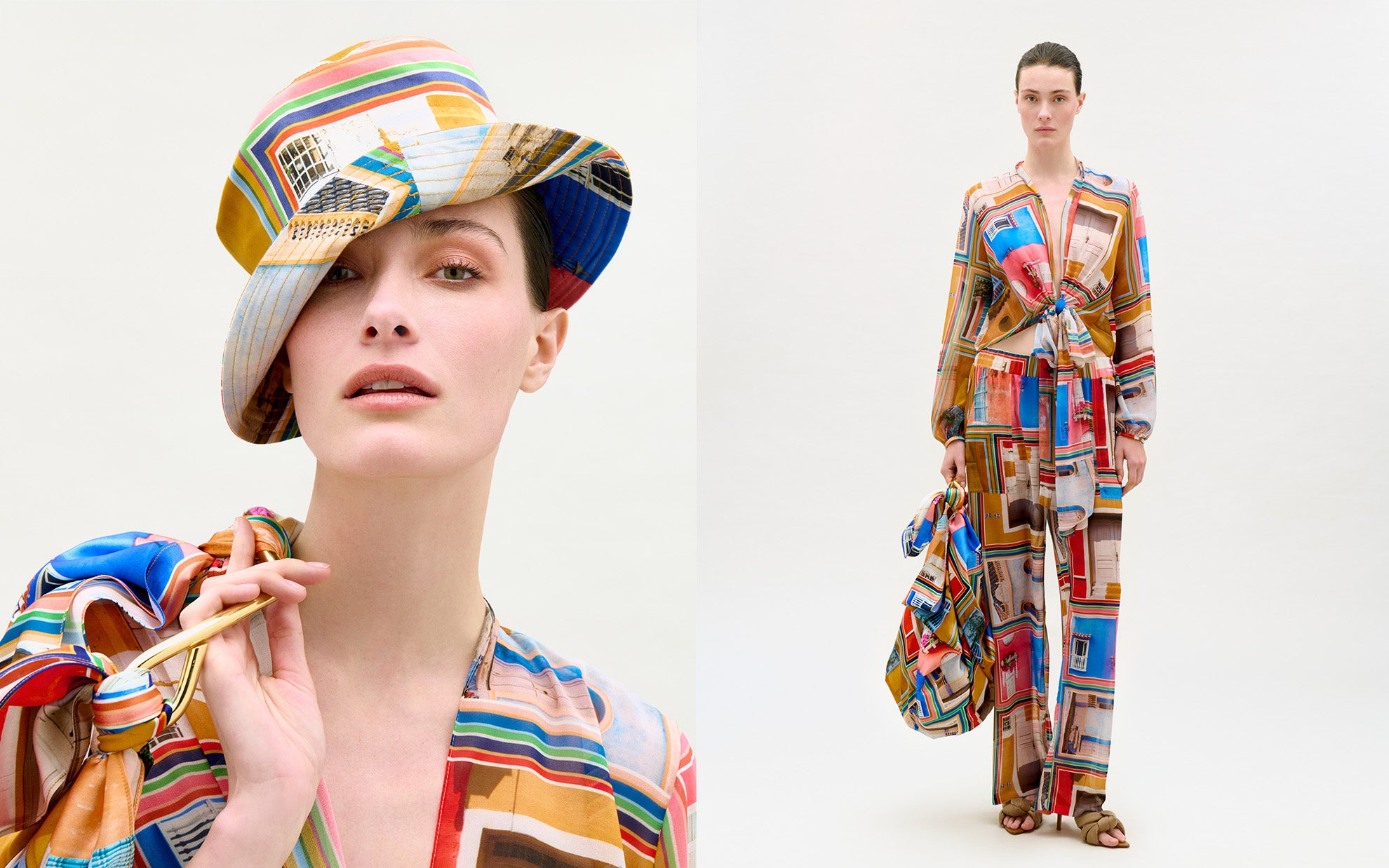 Model wearing a multicolor printed silk outfit with wide-leg pants, matching blouse, and coordinating hat and bag.