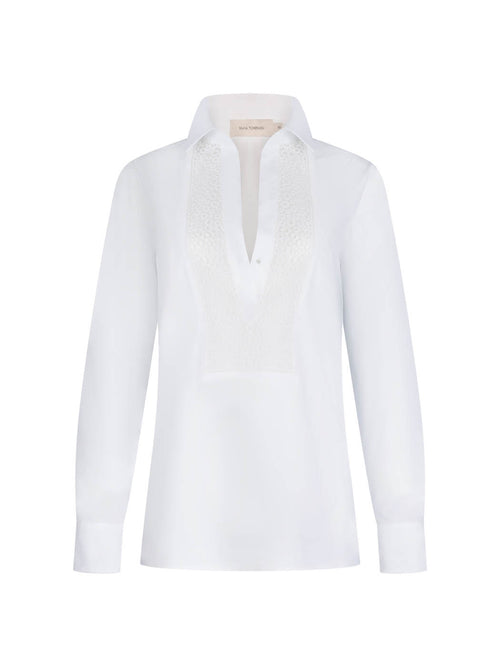 Bega blouse white with a lace-detailed collar and v-neckline on a plain background.