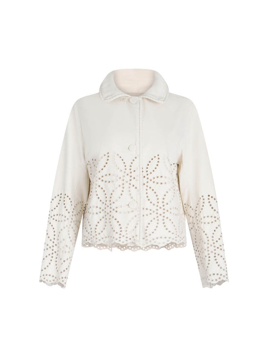 A white Belen Jacket Pearl with a high collar and decorative eyelet perforations on a plain background.