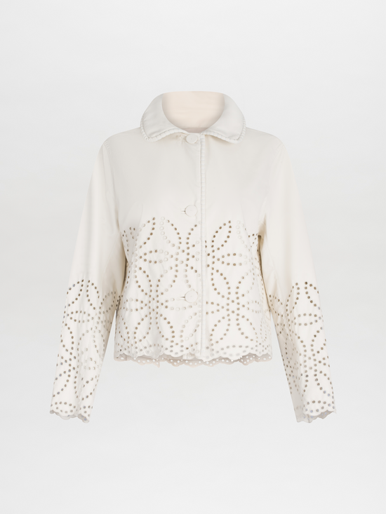 A white Belen Jacket Pearl with a high collar and decorative eyelet perforations on a plain background.